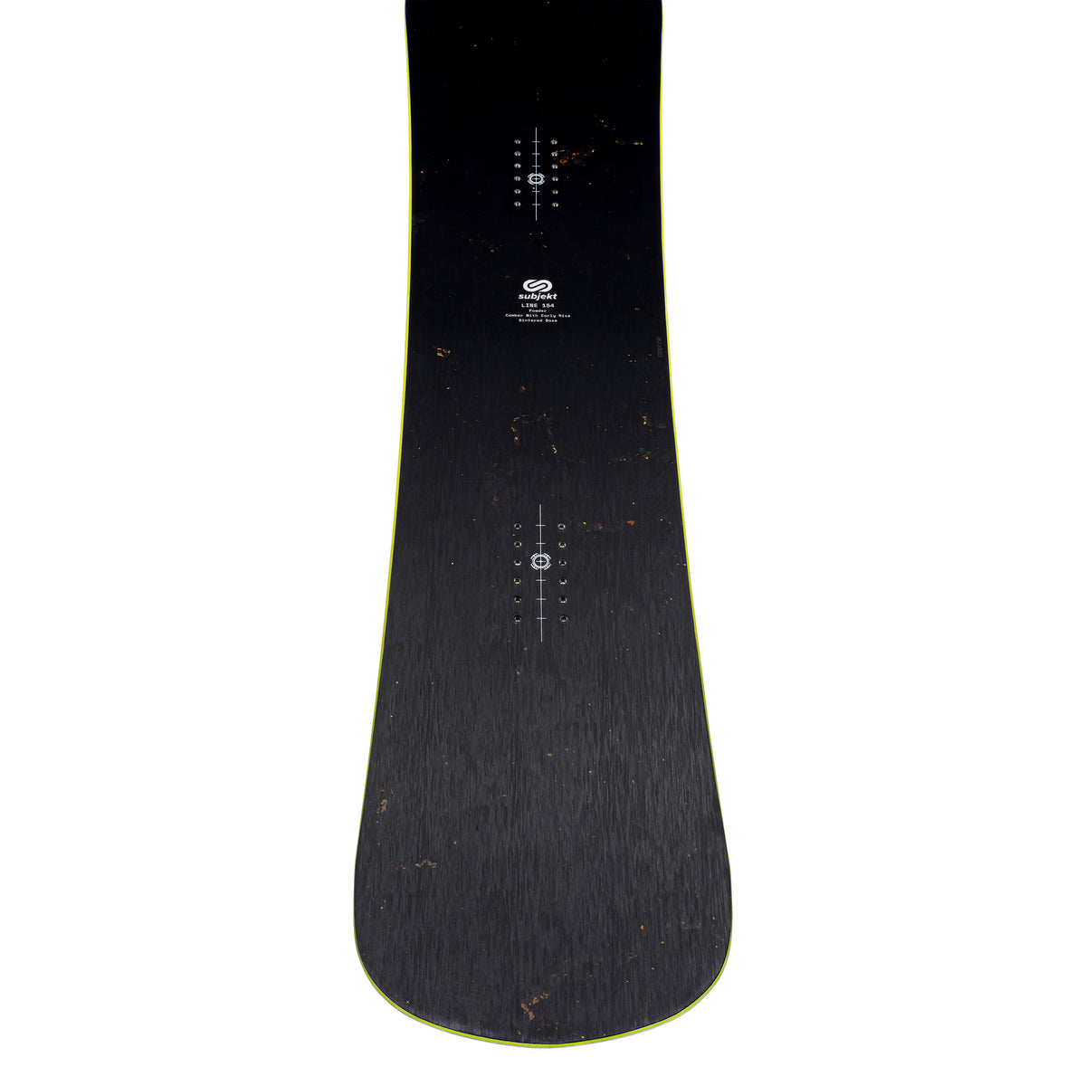 The top of a black snowboard with a subtle yellow-green edge, featuring white printed binding device alignment markings and a small logo near the center, shown against a plain white background.