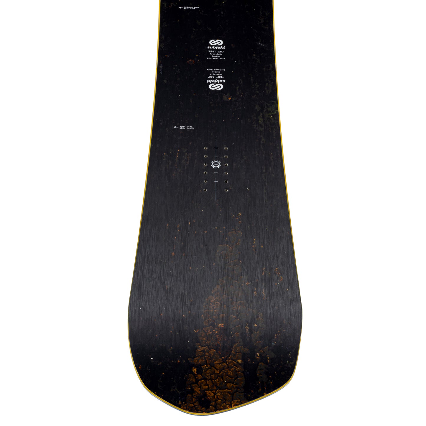 A top-down view of a snowboard deck, showing a dark black wood grain finish with a subtle gold outline along the edges and white printed graphics and branding.